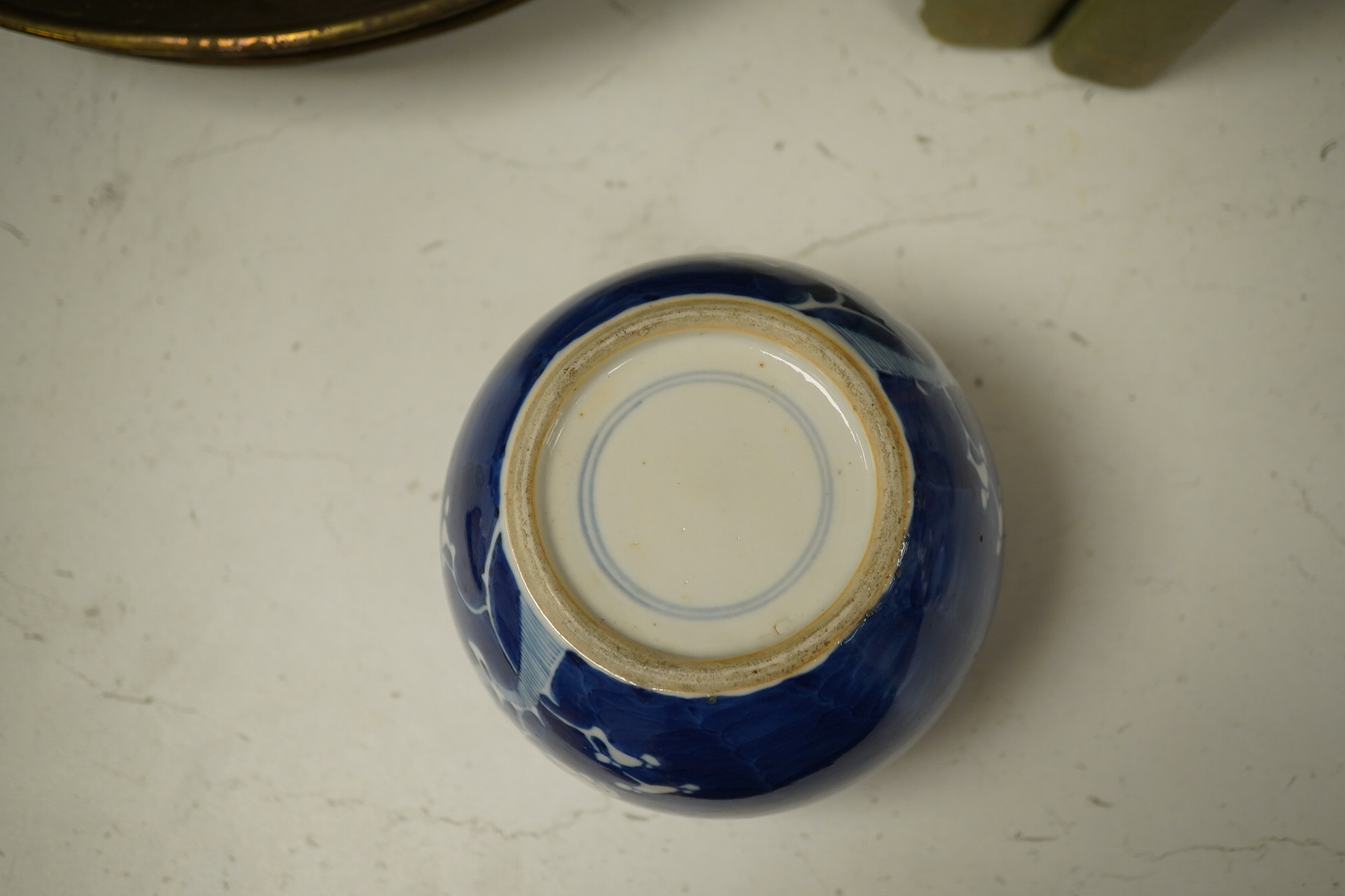 A group of Chinese blue and white porcelain, including a mid 19th century Canton enamel teabowl and a Japanese small dish, tallest 22cm. Condition - fair